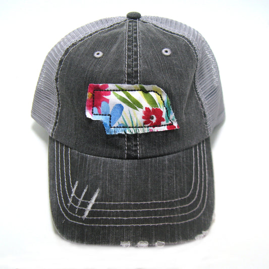 gray distressed trucker hat with gray floral fabric state of Nebraska