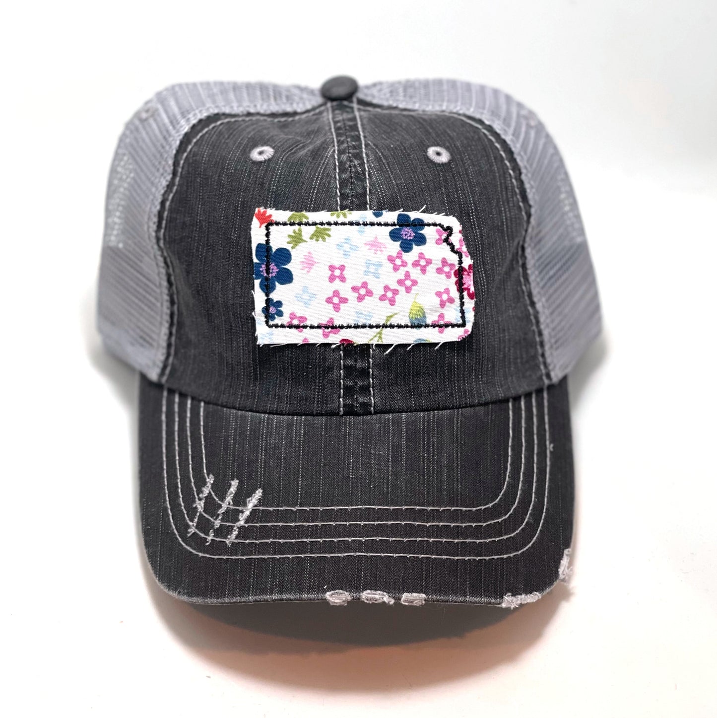 gray distressed trucker hat with gray floral fabric state of Kansas