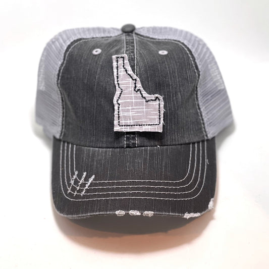 gray distressed trucker hat with gray floral fabric state of Idaho