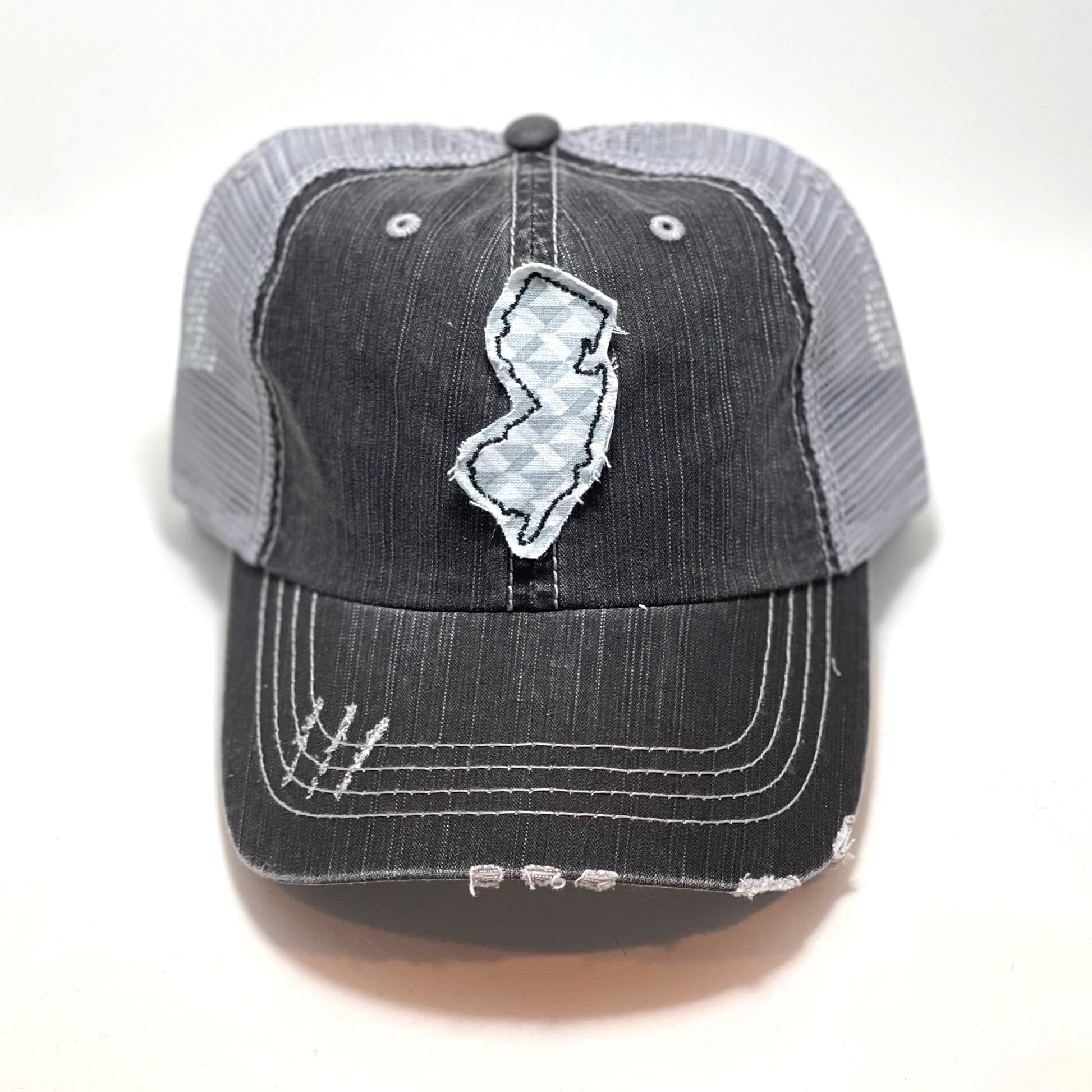 gray distressed trucker hat with gray floral fabric state of New Jersey