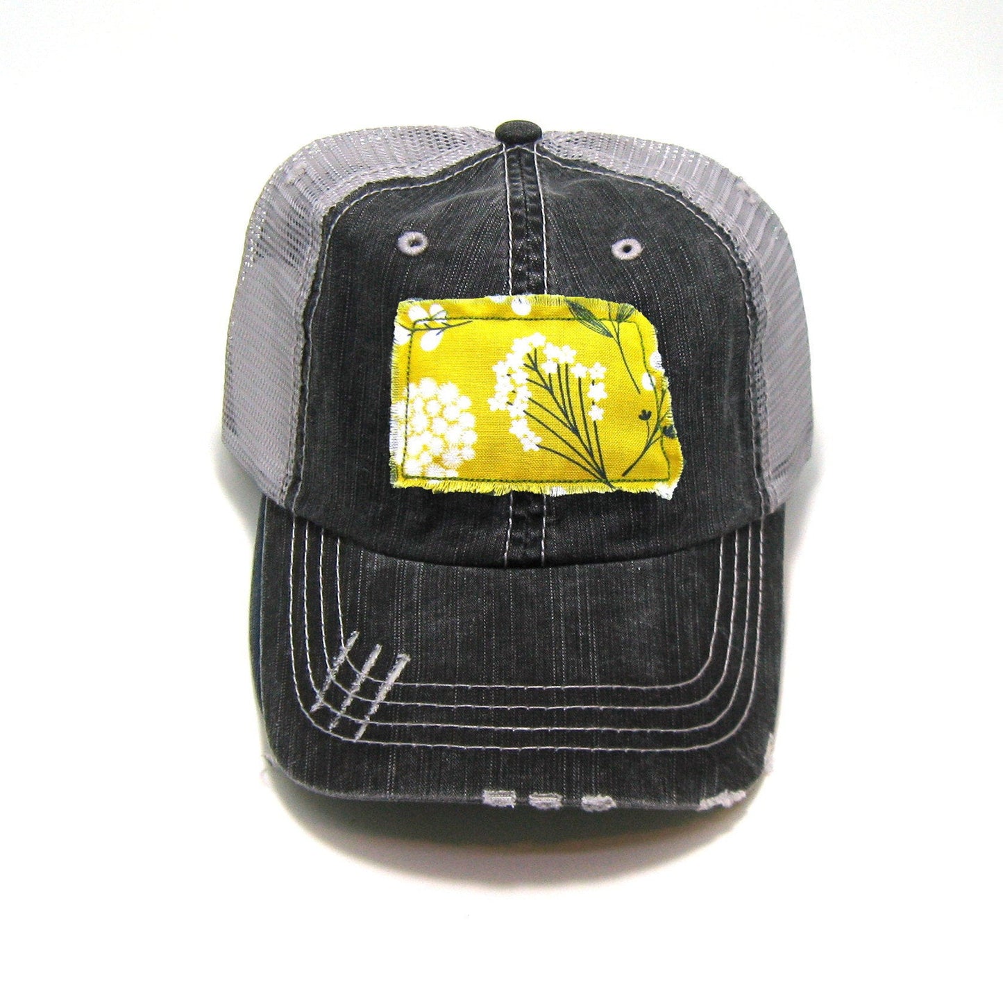 gray distressed trucker hat with gray floral fabric state of North Dakota